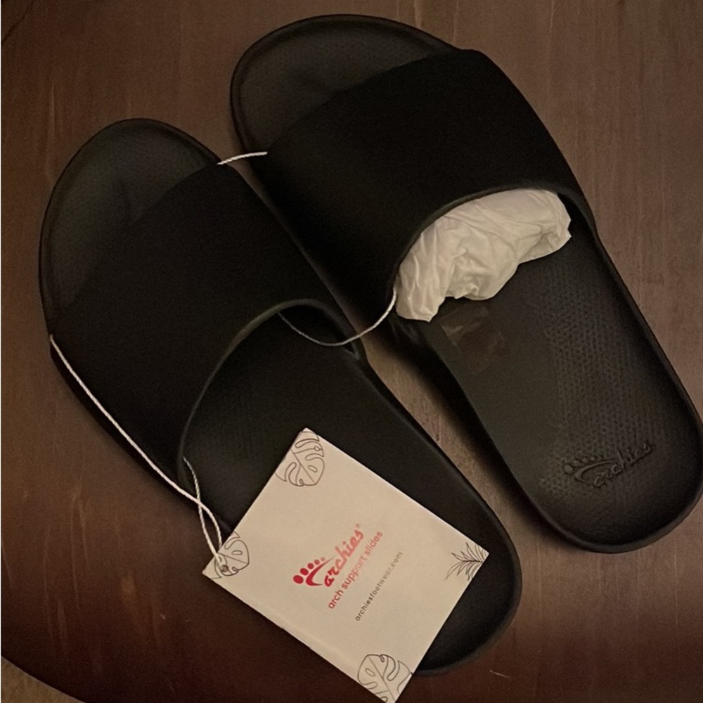 Archie’s new slides!  Great shoes. They do everything for your feet!  Size 7